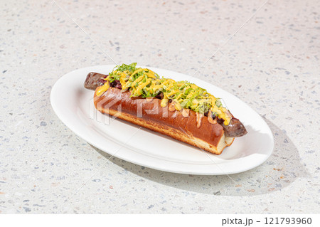 Portion of gourmet american hotdog with sauce Portion of gourmet american hotdog with sauce 121793960