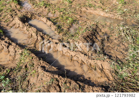 Dirty road with mud 121793982