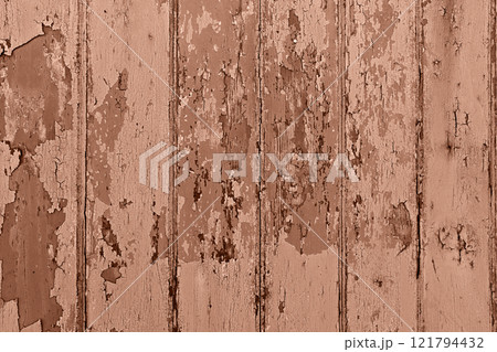 Closeup of distressed wooden wall with peeling paint in a monochromatic mocha mousse tone, showcasing rustic textures and aged charm Closeup of distressed wooden wall with peeling paint in a monochromatic mocha mousse tone, showcasing rustic textures and aged charm 121794432