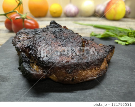 Delicious fried steak on a granite edged board Delicious fried steak on a granite edged board 121795551