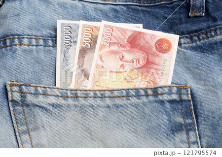 Spanish peseta in the pocket of blue jeans 121795574