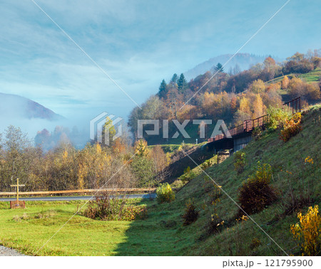 Autumn Carpathian mountains and railroad bridge, Ukraine 121795900