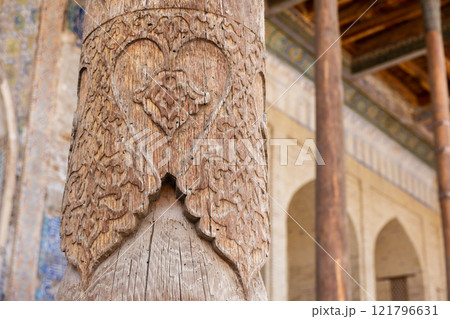 Ancient carved wooden pillar. Bolo Haouz Mosque exterior details Ancient carved wooden pillar. Bolo Haouz Mosque exterior details 121796631