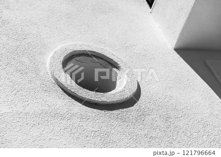 Corners and small round window, background photo 121796664