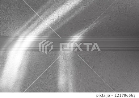 Abstract white interior fragment with light beams pattern 121796665