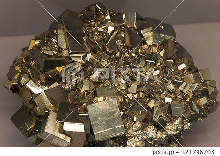 Druse of shiny cubic crystals. The mineral pyrite or iron pyrite 121796703