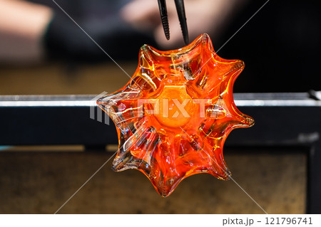 Works at glass blowing workshop Works at glass blowing workshop 121796741