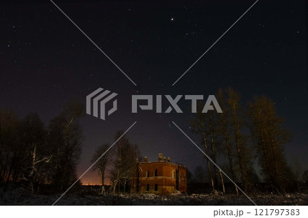 A Mysterious Abandoned Building Standing Alone Under a Starry Night Sky A Mysterious Abandoned Building Standing Alone Under a Starry Night Sky 121797383