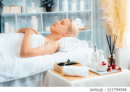 Caucasian woman customer enjoying relaxing anti-stress massage. Quiescent 121798966
