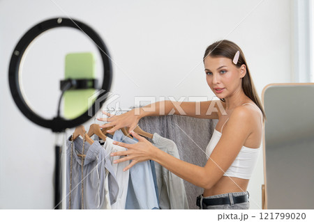 Young woman making fashion video content for social media. Unveiling 121799020
