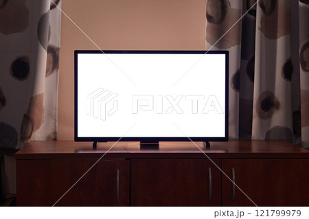 TV in a dim living room, blank screen 121799979