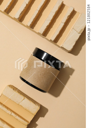 Cosmetic oil in a jar with a brick Cosmetic oil in a jar with a brick 121802584