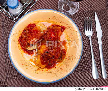 Popular dish of european cuisine is Bacalao Popular dish of european cuisine is Bacalao 121802817