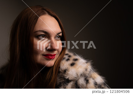 An Elegant and Captivating Portrait of a Woman Fashionably Dressed in Soft Luxurious Fur An Elegant and Captivating Portrait of a Woman Fashionably Dressed in Soft Luxurious Fur 121804506