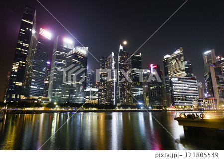 Night view of the Marina Bay Financial Centre and the Raffles Place modern office skyscrapers in Singapore.  121805539