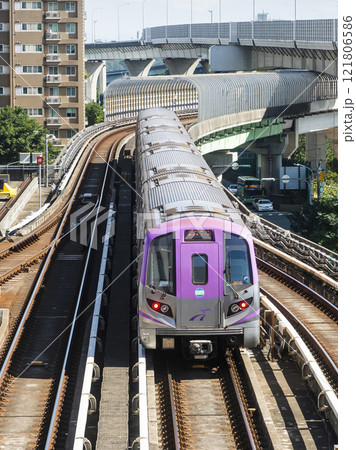 View of a Taoyuan International Airport line train running on the elevated track of the Taoyuan Mass Rapid Transit System. 121806586