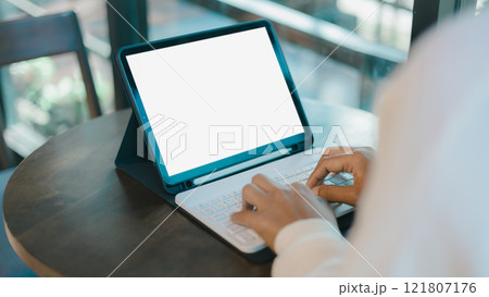 Blank screen tablet with white background for advertising text, Woman use tablet and looking at it, Woman using tablet contact business search information, Marketing and creative design. Blank screen tablet with white background for advertising text, Woman use tablet and looking at it, Woman using tablet contact business search information, Marketing and creative design. 121807176
