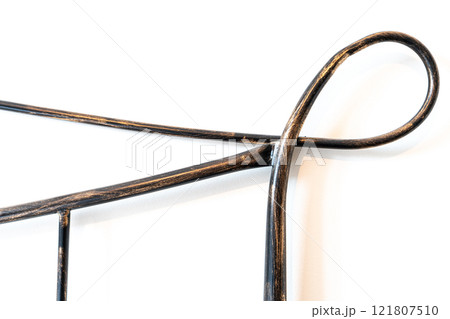 Artistic Wrought Iron Accent on White Background 121807510