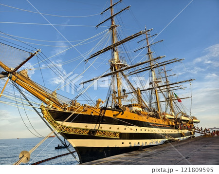 A large old ship at pier under a beautiful blue sky A large old ship at pier under a beautiful blue sky 121809595