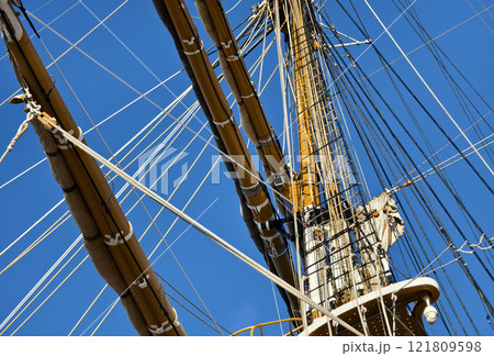 Ropes stretched across the masts of an old ship 121809598
