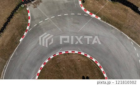 Aerial view race go-kart track, Track for auto racing top view, Car race asphalt and curve street circuit, Go-kart winding race track. 121810302