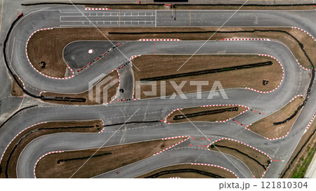 Aerial view race go-kart track, Track for auto racing top view, Car race asphalt and curve street circuit, Go-kart winding race track. Aerial view race go-kart track, Track for auto racing top view, Car race asphalt and curve street circuit, Go-kart winding race track. 121810304