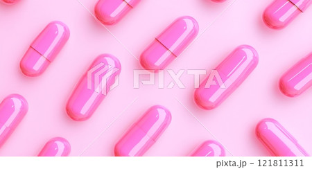 Assorted pastel capsules arranged in a pattern against a soft pink background for an abstract medical theme 121811311