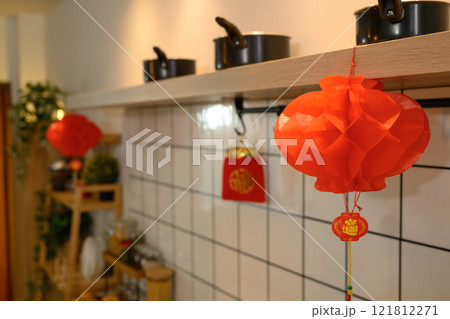 Kitchen decorated for Chinese New Year with red Chinese lanterns symbolizing luck and prosperity Kitchen decorated for Chinese New Year with red Chinese lanterns symbolizing luck and prosperity 121812271