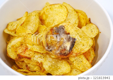 rotten potato chips. potato chips with spices in a bowl. rotten potato chips. potato chips with spices in a bowl. 121813941