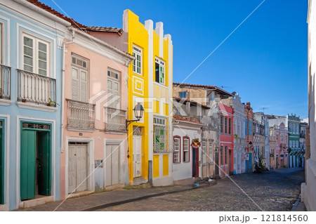 Vibrant colonial street in Salvador de Bahia with colorful houses under a blue sky Vibrant colonial street in Salvador de Bahia with colorful houses under a blue sky 121814560