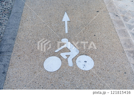 Clear White Bicycle Lane Sign on Concrete Road Surface for Cyclists Safety 121815416