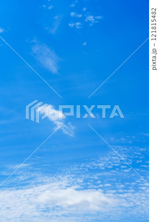 Expansive Light Blue Sky Stretching Overhead With Delicate Wispy White Clouds Floating Gracefully 121815482