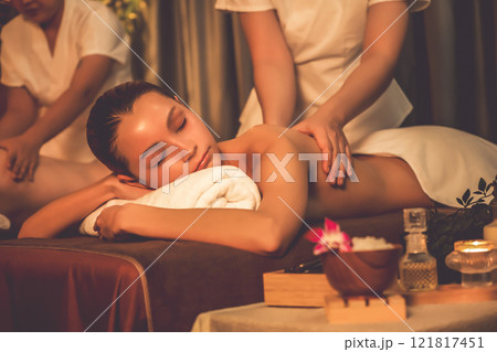 Caucasian couple customer enjoying relaxing anti-stress massage. Quiescent Caucasian couple customer enjoying relaxing anti-stress massage. Quiescent 121817451