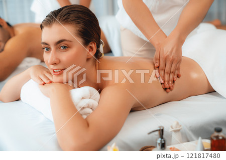 Caucasian couple customer enjoying relaxing anti-stress massage. Quiescent Caucasian couple customer enjoying relaxing anti-stress massage. Quiescent 121817480