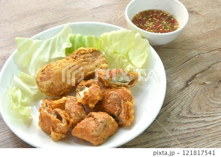 fried slice Vietnamese chicken sausage recipe with cabbage on plate dipping spicy sauce fried slice Vietnamese chicken sausage recipe with cabbage on plate dipping spicy sauce 121817541