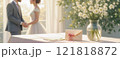 Elegant wedding scene with bride, groom, flowers, and invitation, perfect for banners or ads 121818872