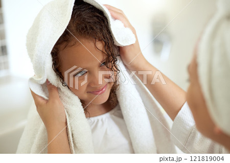 Shower, hygiene and clean daughter bonding with caring, loving and kind mother. Single female parent drying her child with a soft, dry and white towel after a warm bath inside the bathroom at home 121819004