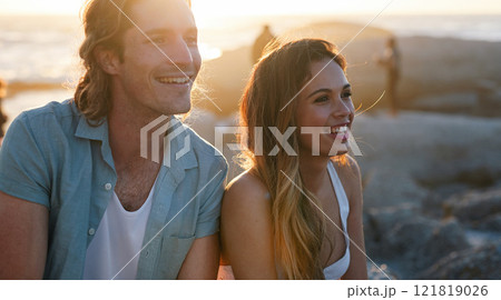 happy couple smiling on beach at sunset enjoying summer 121819026