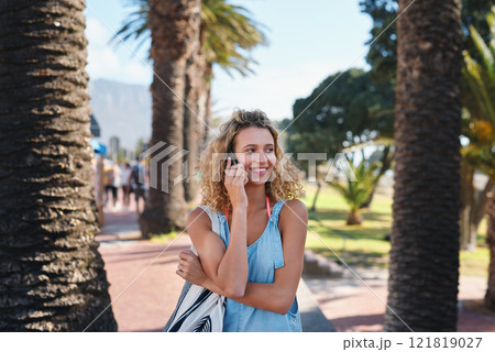 Beautiful tourist woman using smartphone on beachfront having phone call chatting on mobile phone enjoying summer vacation Beautiful tourist woman using smartphone on beachfront having phone call chatting on mobile phone enjoying summer vacation 121819027