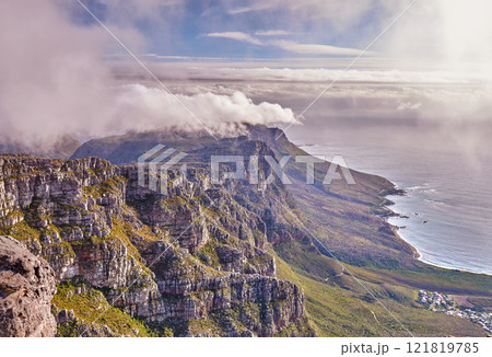 Scenic landscape view of Table Mountain in Cape Town, Western Cape during summer. Beautiful scenery of clouds rolling over a natural landmark on a foggy and misty day in South Africa with copyspace 121819785