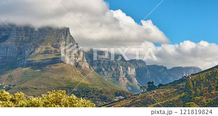 Landscape banner view of a mountain with clouds rolling over in a blue sky in summer. Copyspace, scenic and panoramic view of a natural environment in the countryside. Scenery of hills and nature Landscape banner view of a mountain with clouds rolling over in a blue sky in summer. Copyspace, scenic and panoramic view of a natural environment in the countryside. Scenery of hills and nature 121819824
