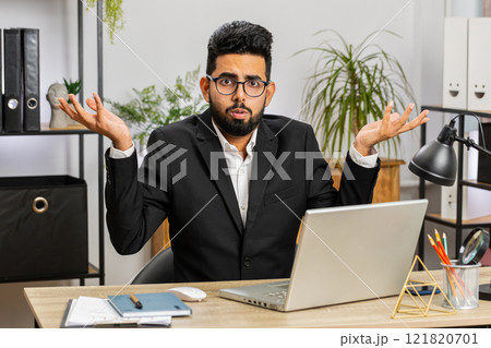 Confused businessman embarrassed about ambiguous question, having doubts, no answer idea, clueless 121820701