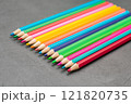 School colored pencils laid out in a row 121820735