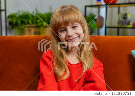 Portrait of happy smiling Caucasian preteen school girl child kid looking at camera, home play room 121820751