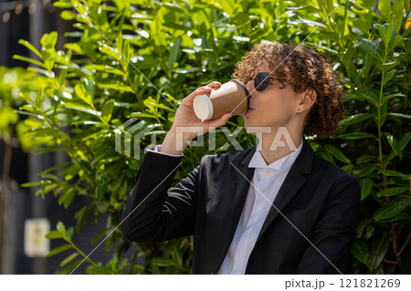 Happy Caucasian businessman enjoying morning coffee hot drink outdoors relaxing, taking a break Happy Caucasian businessman enjoying morning coffee hot drink outdoors relaxing, taking a break 121821269