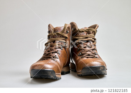 Vintage Brown leather trekking shoes isolated on white Vintage Brown leather trekking shoes isolated on white 121822185