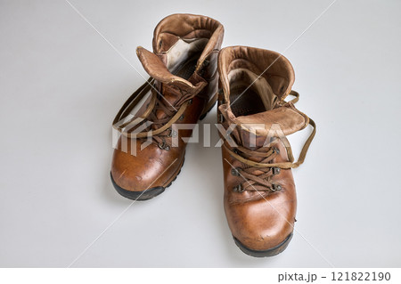 Vintage Brown  leather trekking shoes isolated on white 121822190