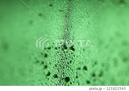 Close Up of Condensation Floating Liquid Water Bubbles and Drips on Glass from Rain 121822543