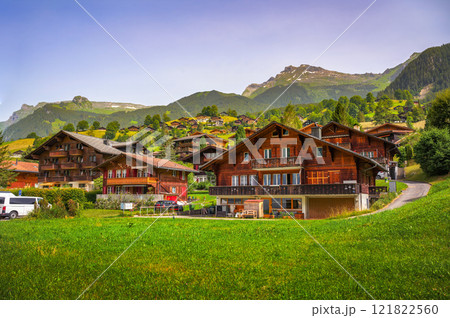 Traditional cottages in the village of Grindelwald, Swiss Alps, Switzerland Traditional cottages in the village of Grindelwald, Swiss Alps, Switzerland 121822560