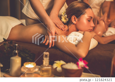 Caucasian couple customer enjoying relaxing anti-stress massage. Quiescent Caucasian couple customer enjoying relaxing anti-stress massage. Quiescent 121824321